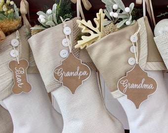 Personalized Stocking Tags - Warm Neutral Elegance - Arabesque Shape - Hand Calligraphy Names in White on Shimmery Antique Bronze Metallic