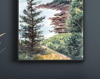 May include: Watercolor painting of a coastal landscape with a black frame. The artwork depicts a shoreline with rocky cliffs, evergreen trees, and a calm sea under a light blue sky. The painting is displayed above a wooden cabinet.