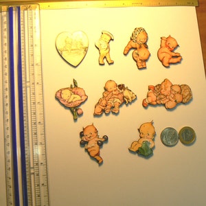 9 Kewpie wood cut outs.