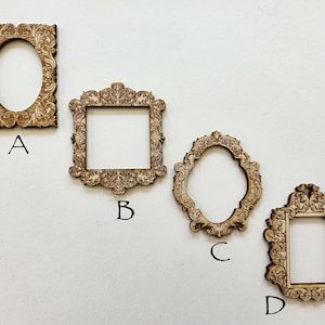 May include: Four intricately carved wooden frames in various shapes: oval, square, and rectangular. Each frame features detailed floral and scrollwork designs. The frames are labelled A, B, C, and D.
