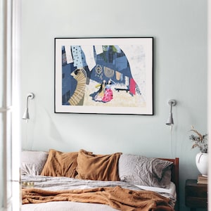 May include: A framed abstract art print with a blue, white, and yellow color scheme. The print features a stylized cityscape with figures in the foreground.