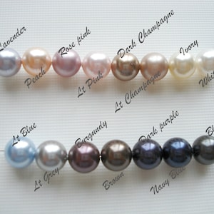 May include: A string of pearls in various colors, including lavender, peach, rose pink, light pink, dark champagne, light champagne, ivory, white, light blue, light grey, burgundy, brown, dark purple, navy blue, and black.