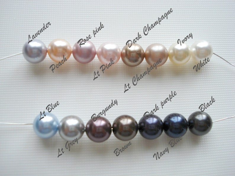 May include: A string of pearls in various colors, including lavender, peach, rose pink, light pink, dark champagne, light champagne, ivory, white, light blue, light grey, burgundy, brown, dark purple, navy blue, and black.