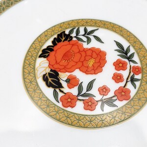 Lilily Cakara Dinnerware set, service for 8 Dinner plartes, salad plates, Soup Bowl, cup and saucer. Also Large oval platter, vegetable bowl and Covered Sugar (1)