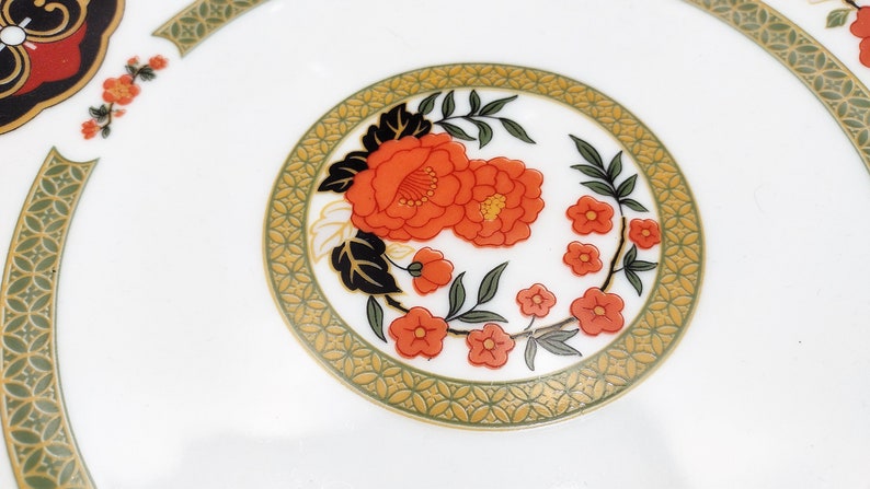 Lilily Cakara Dinnerware set, service for 8 Dinner plartes, salad plates, Soup Bowl, cup and saucer. Also Large oval platter, vegetable bowl and Covered Sugar (1)