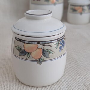 Mikasa Garden Harvest CAC29 stoneware Small canister  with fruit and leaf border on cream glaze.