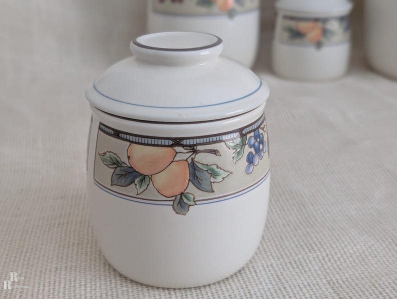 Mikasa Garden Harvest CAC29 stoneware Small canister  with fruit and leaf border on cream glaze.