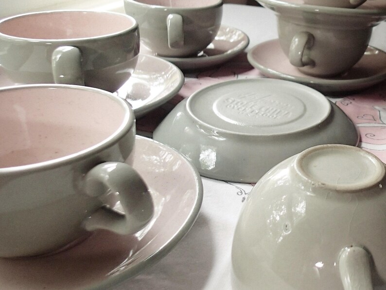 Harkerware Oven Proof Shell pink dinnerware pieces. Shell pink with dove gray undersides. Mid Century Modern plates, cups and saucers sold in set