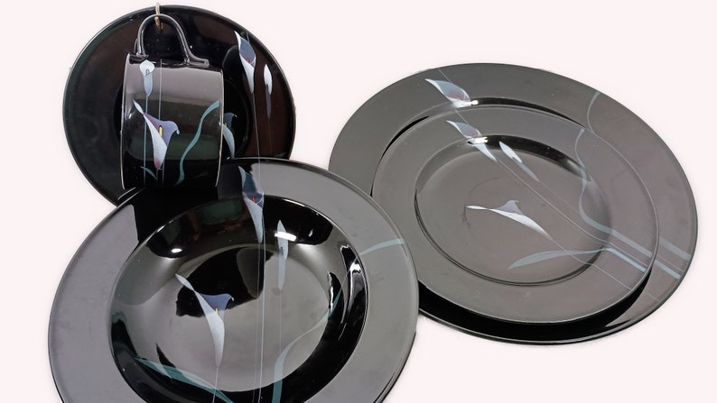 Mikasa Galleria Opus Black five piece place setting. Mystical Calla Lilys on black dinner plate, salad plate, soup bowl, cup and saucers.