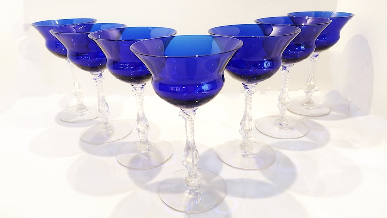 Set of 7 Antique Cobalt Royal Blue 3126 Cambridge Glass Champagne / Tall Sherbet Stemware.  Beautiful, clear cobalt blue art deco style angular flare top on a bulbous, bulging bowl with graceful foliated clear glass tall stems.