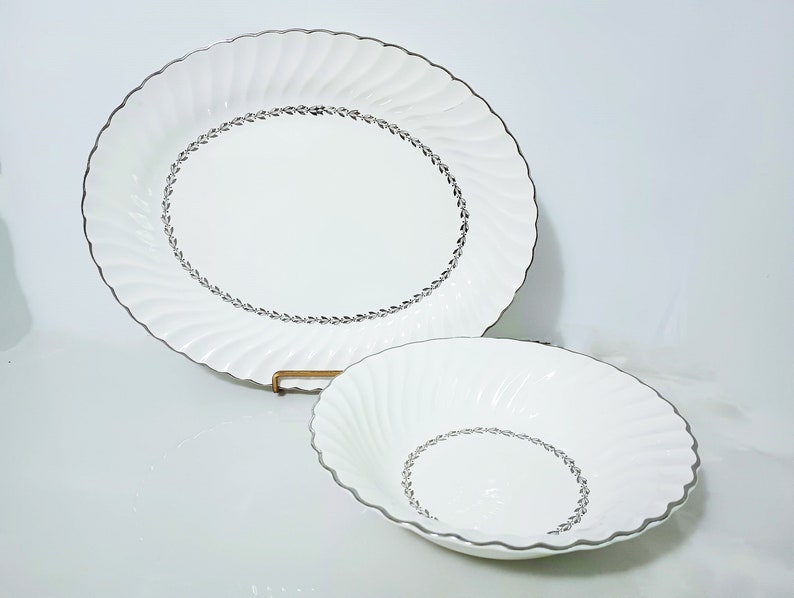 Mid Century Homer Laughlin Arcadia Dinnerware. Silver Platinum wreath of leaves around inner circle, Platinum trim on scalloped rimmed white china oval platter and round vegetable bowl.