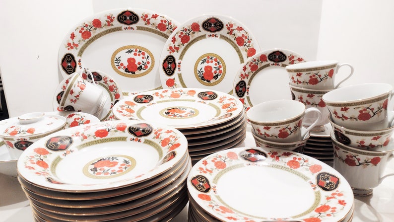 Lilily Cakara Dinnerware set, service for 8 Dinner plartes, salad plates, Soup Bowl, cup and saucer. Also Large oval platter, vegetable bowl and Covered Sugar (1)