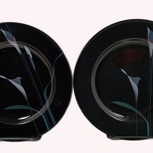 Set of 2 Set of 2 Mikasa Galleria Opus Black five piece place setting. Mystical Calla Lilys on black salad plates.