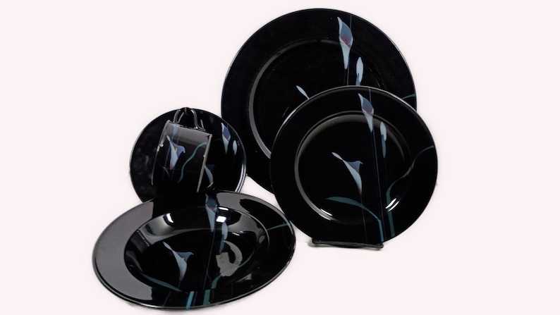 Mikasa Galleria Opus Black five piece place setting. Mystical Calla Lilys on black dinner plate, salad plate, soup bowl, cup and saucers.