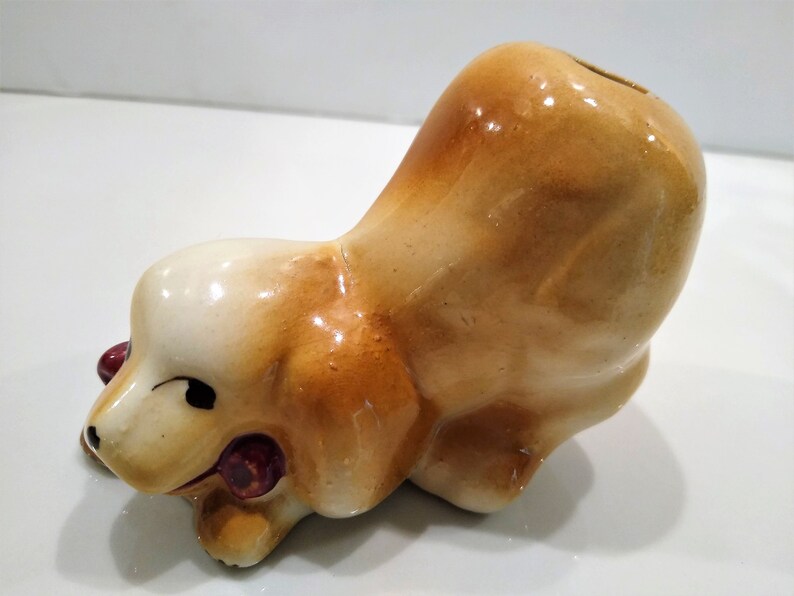 Antique short haired Dog Figurine Perfume Diffusers. Sometimes listed as Antique Toothbrush or toothpick Holder, however it was likely originally made as perfume diffusers