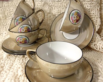 RS Germany lusterware porcelain cup and saucer duos, beige yellow luster, floral bouquet, Reinhold Schlegelmilch