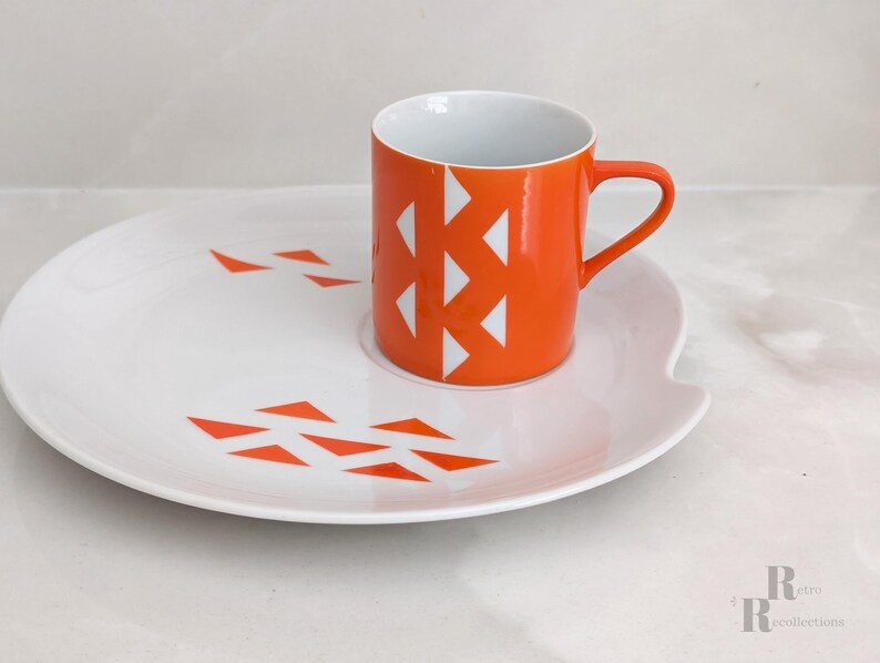 Jonas Roberts Japan snack set with white yin yang snack plate with orange diamonds and orange cup with white diamond pattern
