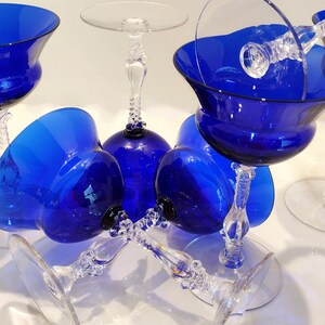 Set of 7 Antique Cobalt Royal Blue 3126 Cambridge Glass Champagne / Tall Sherbet Stemware.  Beautiful, clear cobalt blue art deco style angular flare top on a bulbous, bulging bowl with graceful foliated clear glass tall stems.