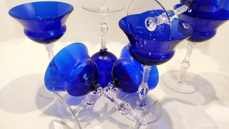Set of 7 Antique Cobalt Royal Blue 3126 Cambridge Glass Champagne / Tall Sherbet Stemware.  Beautiful, clear cobalt blue art deco style angular flare top on a bulbous, bulging bowl with graceful foliated clear glass tall stems.