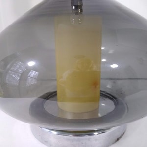 Mid Century Modern Minimalist Blenko Art Glass Table Lamp. Hand blown smoke glass garlic shape body, chrome finish neck and base. Fiberglass light diffuser inside glass body for mood light.