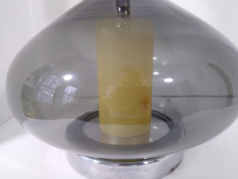 Mid Century Modern Minimalist Blenko Art Glass Table Lamp. Hand blown smoke glass garlic shape body, chrome finish neck and base. Fiberglass light diffuser inside glass body for mood light.