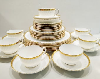 Minton Fine China Gold Rose Dinnerware, 1950s place settings