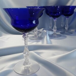 Set of 7 Antique Cobalt Royal Blue 3126 Cambridge Glass Champagne / Tall Sherbet Stemware.  Beautiful, clear cobalt blue art deco style angular flare top on a bulbous, bulging bowl with graceful foliated clear glass tall stems.