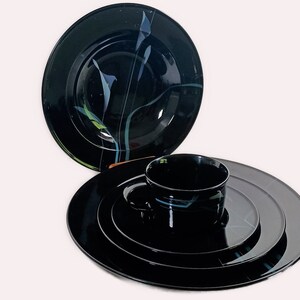 Mikasa Galleria Opus Black five piece place setting. Mystical Calla Lilys on black dinner plate, salad plate, soup bowl, cup and saucers.