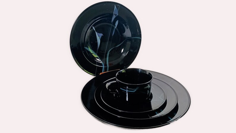 Mikasa Galleria Opus Black five piece place setting. Mystical Calla Lilys on black dinner plate, salad plate, soup bowl, cup and saucers.