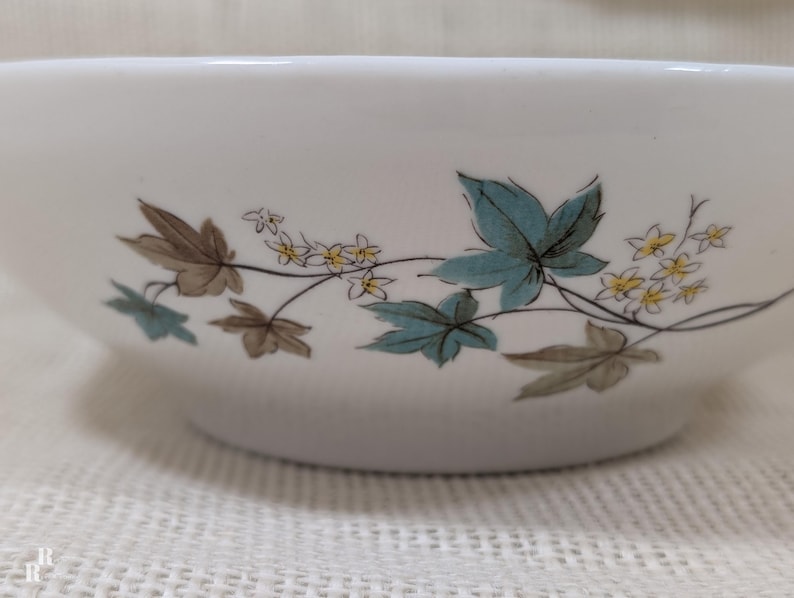 Mid‑century Syracuse China Woodbine serving bowl with the aqua and brown floral motif on a bright white glaze.