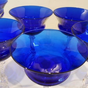 Set of 7 Antique Cobalt Royal Blue 3126 Cambridge Glass Champagne / Tall Sherbet Stemware.  Beautiful, clear cobalt blue art deco style angular flare top on a bulbous, bulging bowl with graceful foliated clear glass tall stems.