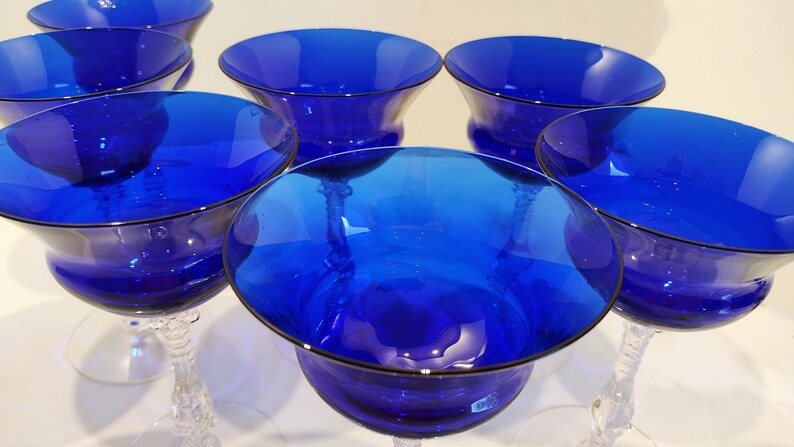 Set of 7 Antique Cobalt Royal Blue 3126 Cambridge Glass Champagne / Tall Sherbet Stemware.  Beautiful, clear cobalt blue art deco style angular flare top on a bulbous, bulging bowl with graceful foliated clear glass tall stems.