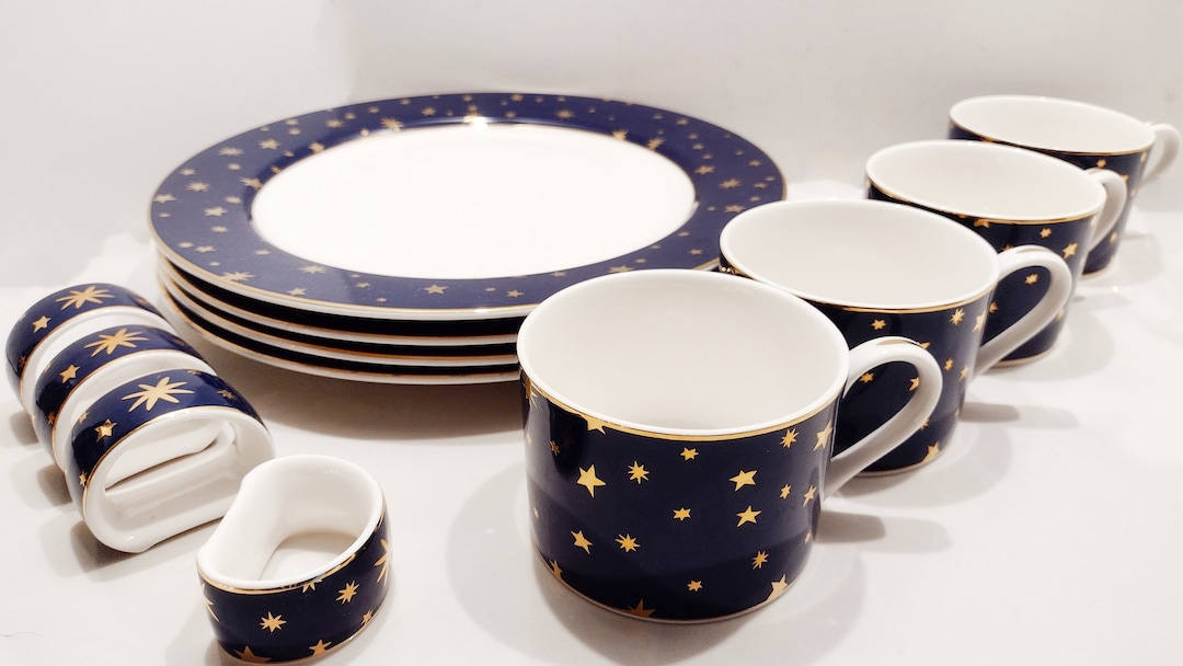Vintage Sakura Galaxy Dinnerware Set. 4 Dinner Plates, 4 Flat Cups and 4 Napkin Rings in