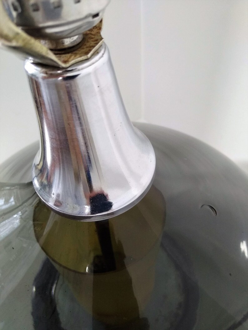 Mid Century Modern Minimalist Blenko Art Glass Table Lamp. Hand blown smoke glass garlic shape body, chrome finish neck and base. Fiberglass light diffuser inside glass body for mood light.