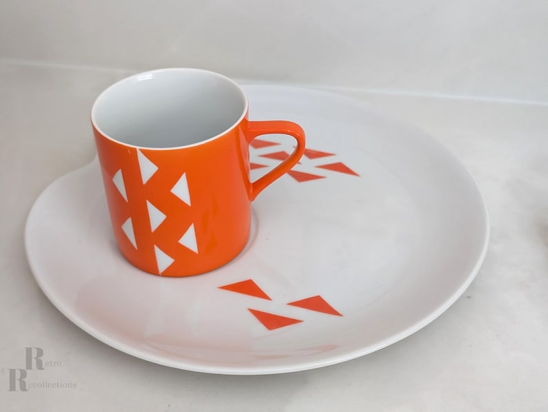 Jonas Roberts Japan snack set with white yin yang snack plate with orange diamonds and orange cup with white diamond pattern