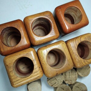 Mid Century Turned Stacked Layered Wood Spice Containers with Cork Stoppers. Set of 6 wooden spice jars  ade of Layers of various varieties of dark and light colored wood stacked together, turned, and finished to warm rich layers of natural wood.
