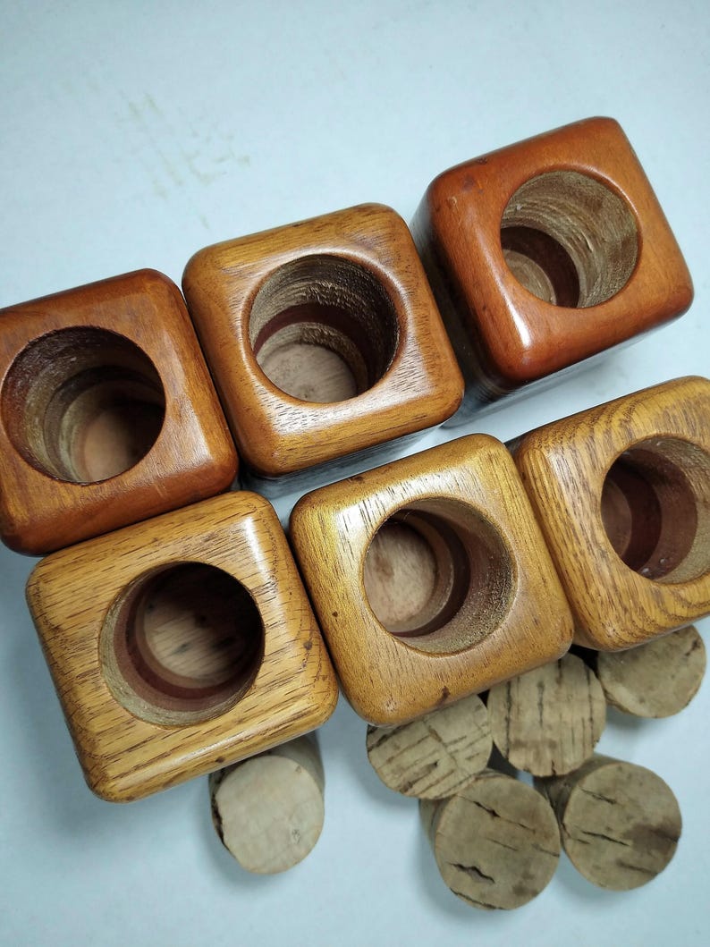 Mid Century Turned Stacked Layered Wood Spice Containers with Cork Stoppers. Set of 6 wooden spice jars  ade of Layers of various varieties of dark and light colored wood stacked together, turned, and finished to warm rich layers of natural wood.