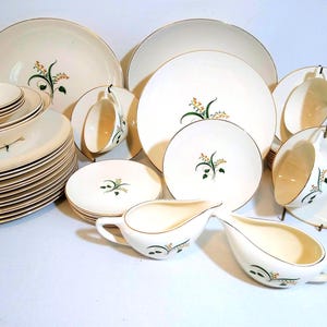 Knowles Forsythia Mid Century dinnerware. Sold in sets of place settings, sets, and individual pieces.
