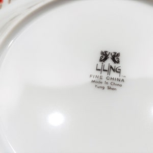 Lilily Cakara Dinnerware set, service for 8 Dinner plartes, salad plates, Soup Bowl, cup and saucer. Also Large oval platter, vegetable bowl and Covered Sugar (1)