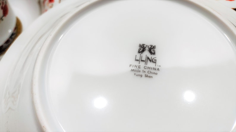 Lilily Cakara Dinnerware set, service for 8 Dinner plartes, salad plates, Soup Bowl, cup and saucer. Also Large oval platter, vegetable bowl and Covered Sugar (1)