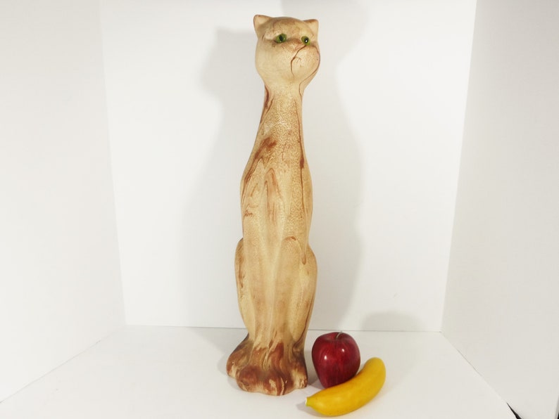 Tall and Lean Mountain Lion Cat Souvenir from Glacier Park. 1970s Nemadji like clay body looks like flowing rivers of light to dark brown sand. Pottery Mid Century Style wild cougar with glass or plastic green eyes. 22 inches tall,