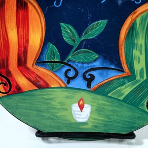 Furio Café salad plate colorful empty chairs sitting at a French Cafe scene with two colorful and a cafe table