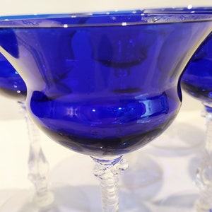 Set of 7 Antique Cobalt Royal Blue 3126 Cambridge Glass Champagne / Tall Sherbet Stemware.  Beautiful, clear cobalt blue art deco style angular flare top on a bulbous, bulging bowl with graceful foliated clear glass tall stems.