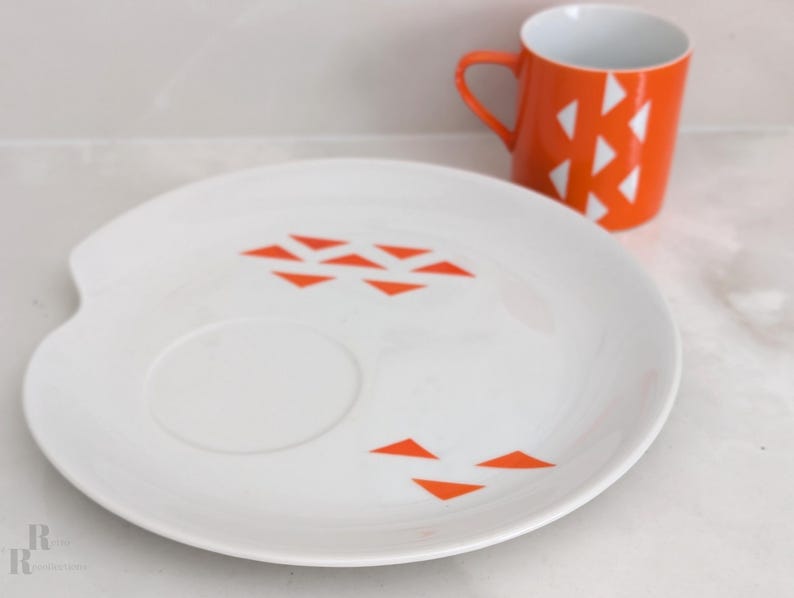 Jonas Roberts Japan snack set with white yin yang snack plate with orange diamonds and orange cup with white diamond pattern
