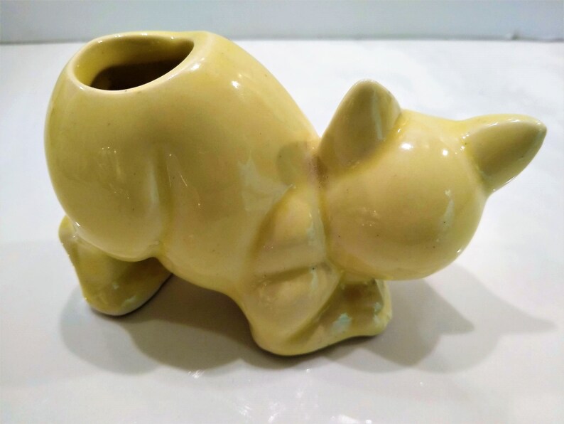 Antique Yellow Cat Figurine Perfume Diffusers. Sometimes listed as Antique Toothbrush or toothpick Holder, however it was likely originally made as perfume diffusers