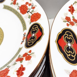 Lilily Cakara Dinnerware set, service for 8 Dinner plartes, salad plates, Soup Bowl, cup and saucer. Also Large oval platter, vegetable bowl and Covered Sugar (1)