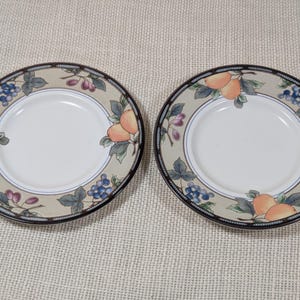 Mikasa Garden Harvest CAC29 set of 2 saucers with fruit and leaf border on cream glaze.