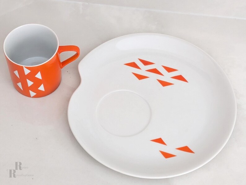 Jonas Roberts Japan snack set with white yin yang snack plate with orange diamonds and orange cup with white diamond pattern