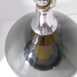 Mid Century Modern Minimalist Blenko Art Glass Table Lamp. Hand blown smoke glass garlic shape body, chrome finish neck and base. Fiberglass light diffuser inside glass body for mood light.