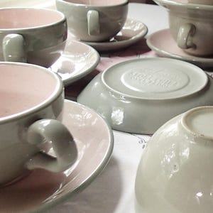 Harkerware Oven Proof Shell pink dinnerware pieces. Shell pink with dove gray undersides. Mid Century Modern plates, cups and saucers sold in sets.